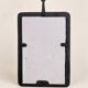 Vintage black wall mirror with floral decoration