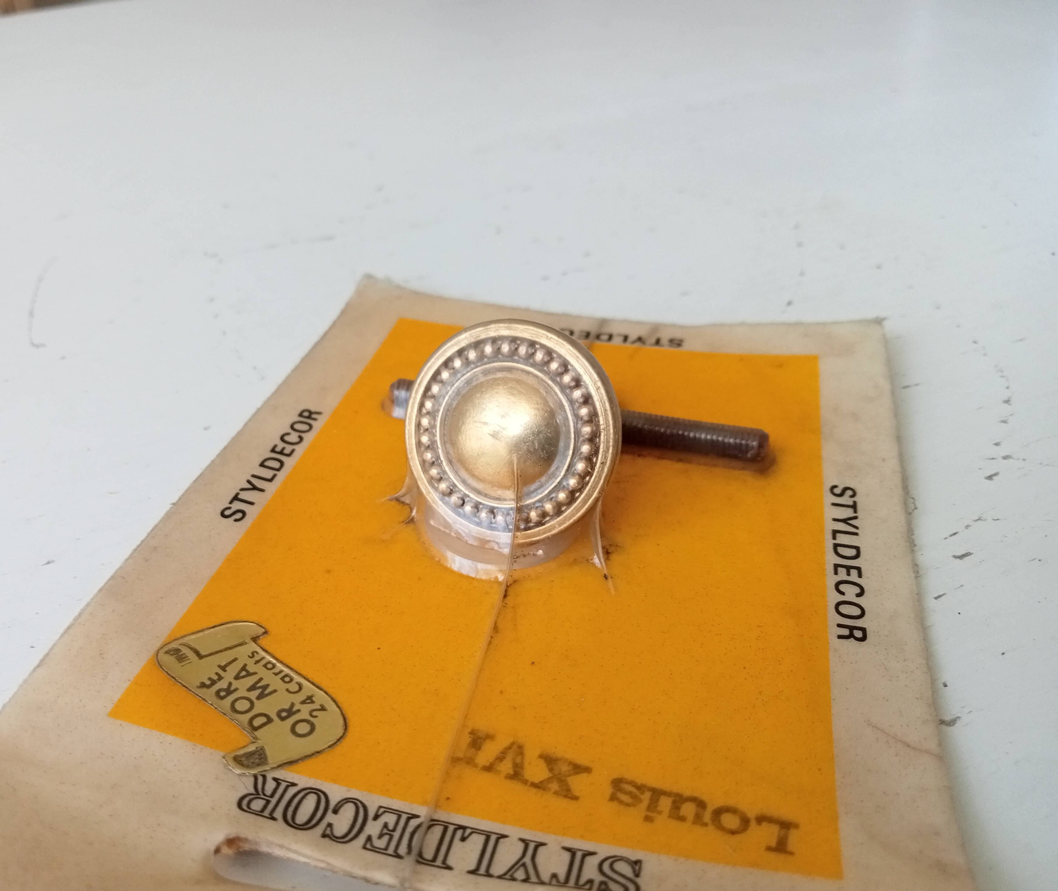 Vintage furniture knob in Louis XVI style, gilded with fine gold.