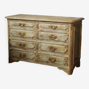 Old beige patinated chest of drawers