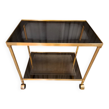 Serving cart in gilded brass and tinted glass