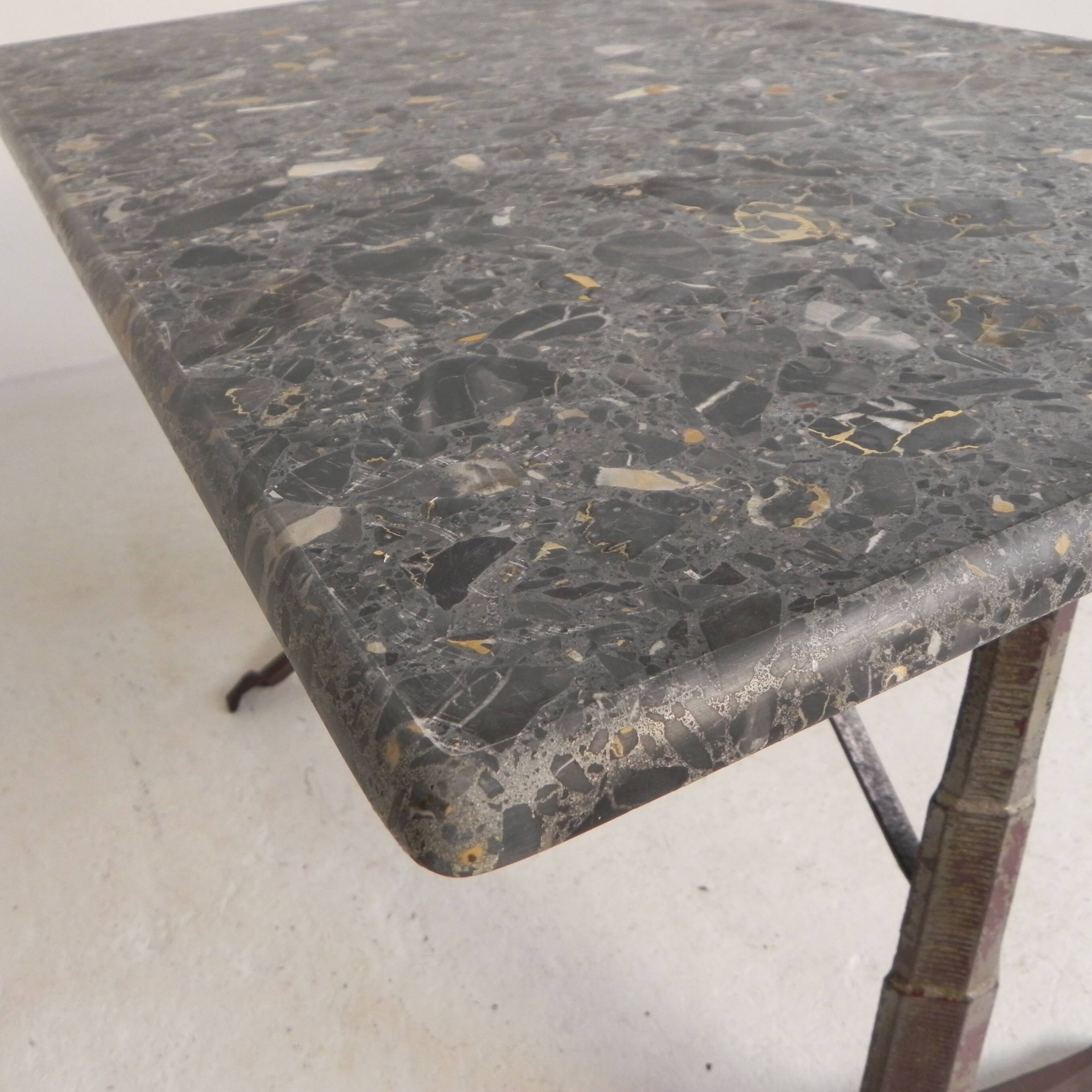 Bistro table with a marble top on a cast iron frame, 1930s.