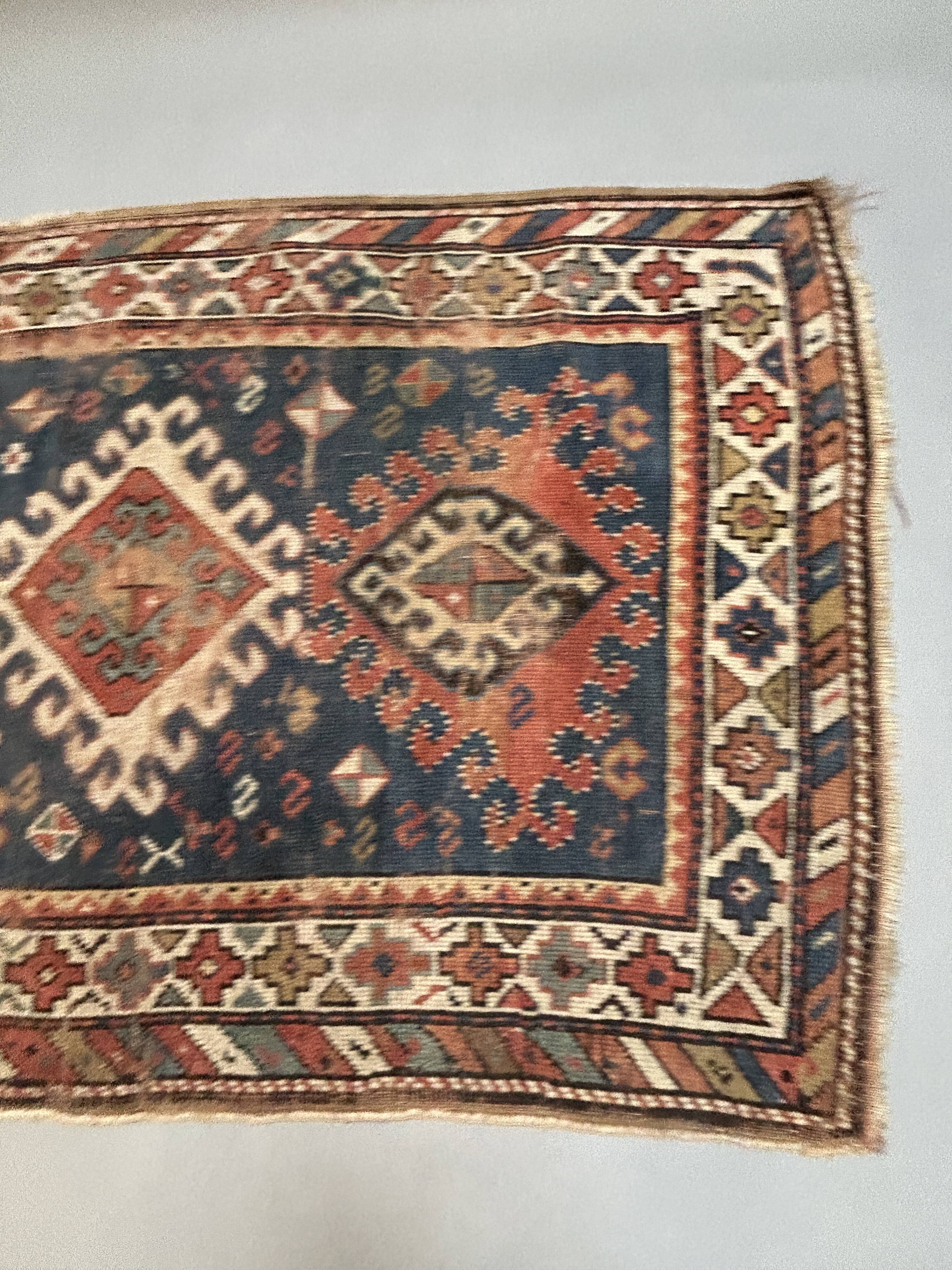 Antique kazak rug blue ground