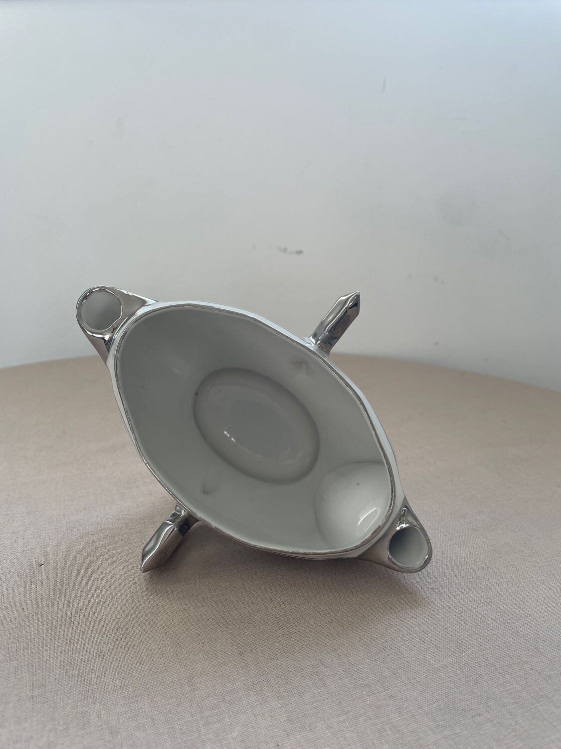 Antique white French porcelain sauce boat M&S with silver trim.