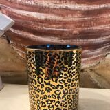 Photophore relief gold and black wild pattern