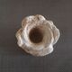 Candlestick in carved stone, signed