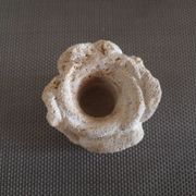 Candlestick in carved stone, signed