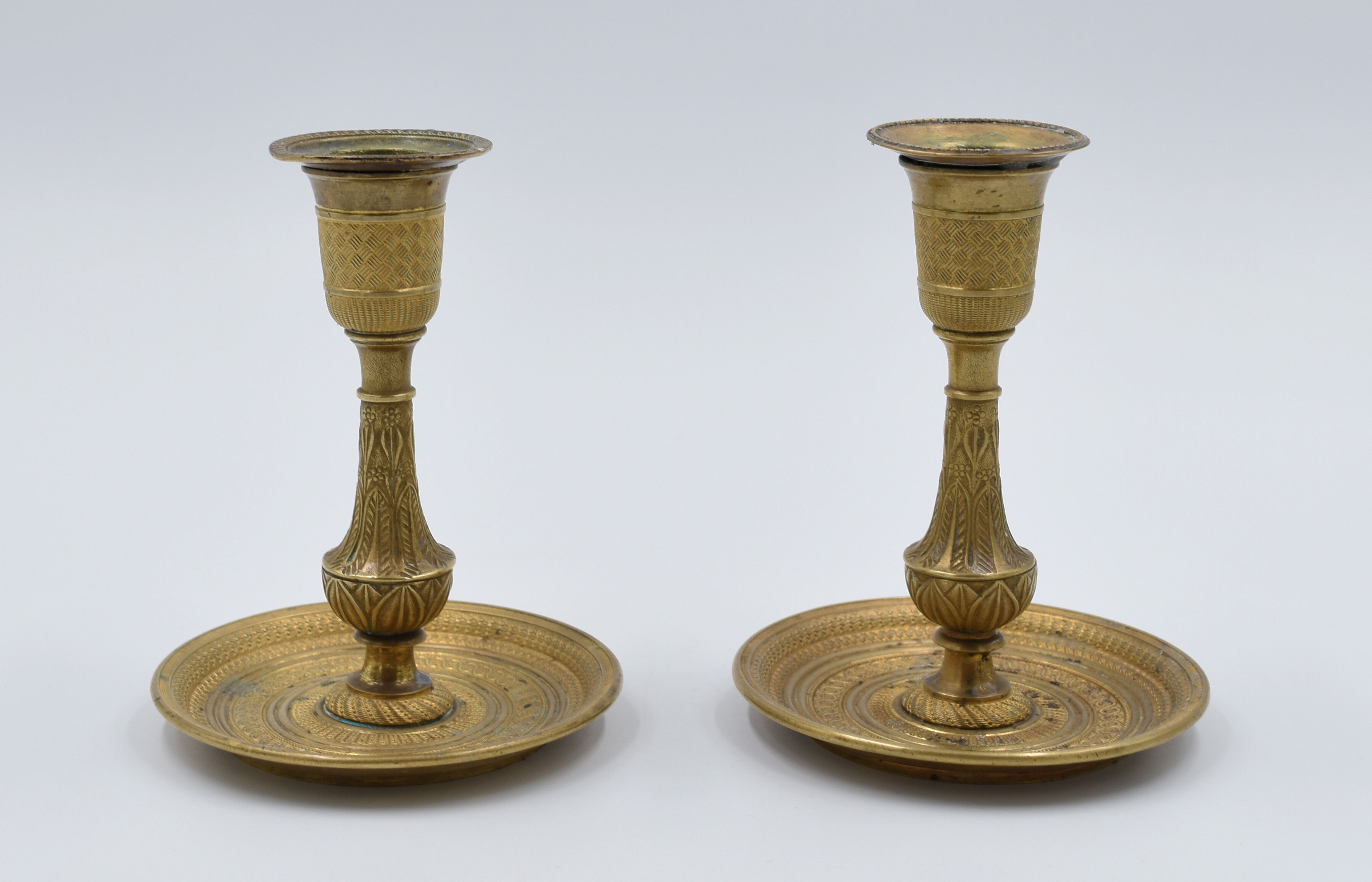 Pair of gossip candle holders in bronze and brass gilded period