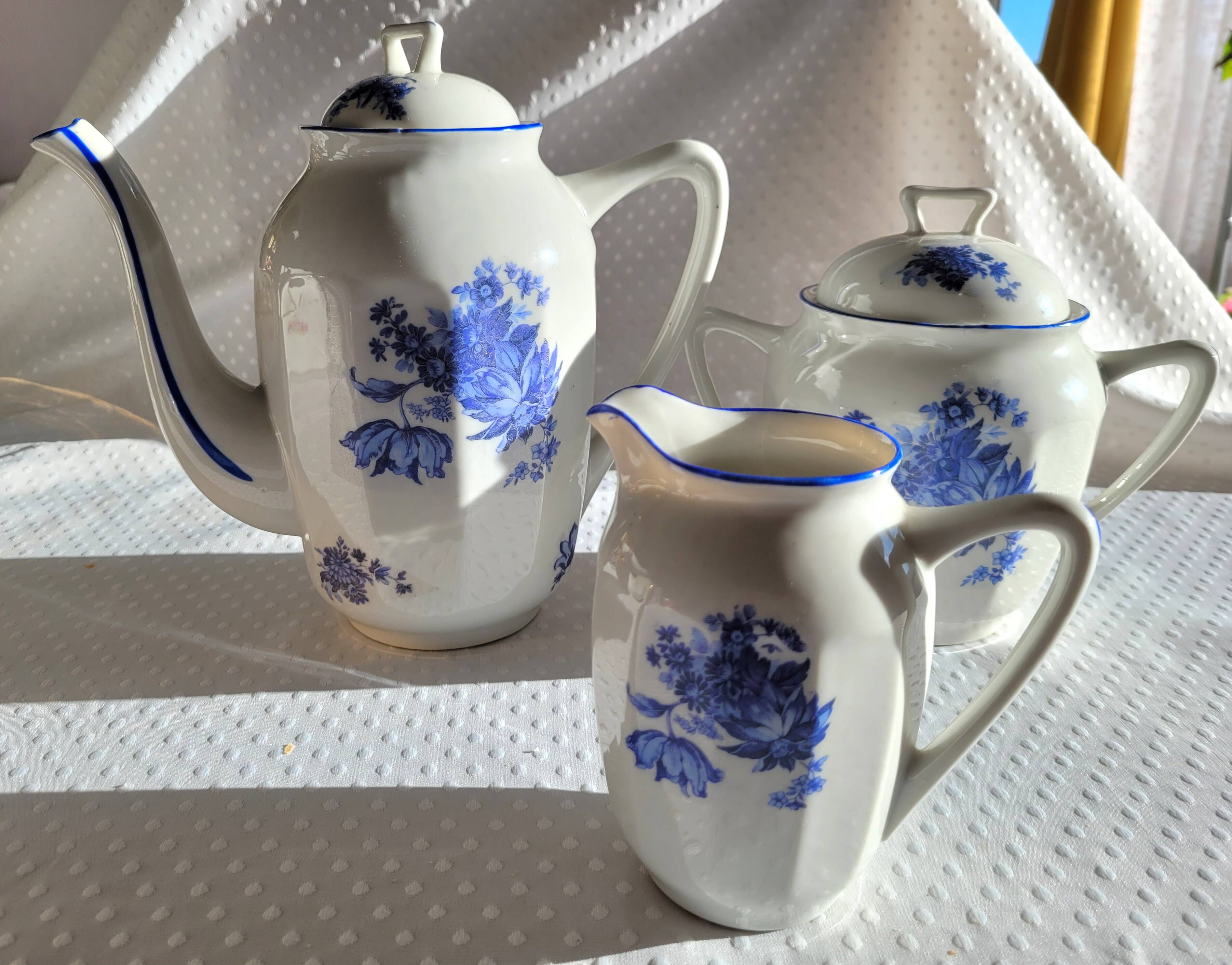 Blue and white ceramic coffee service with vintage flowers.