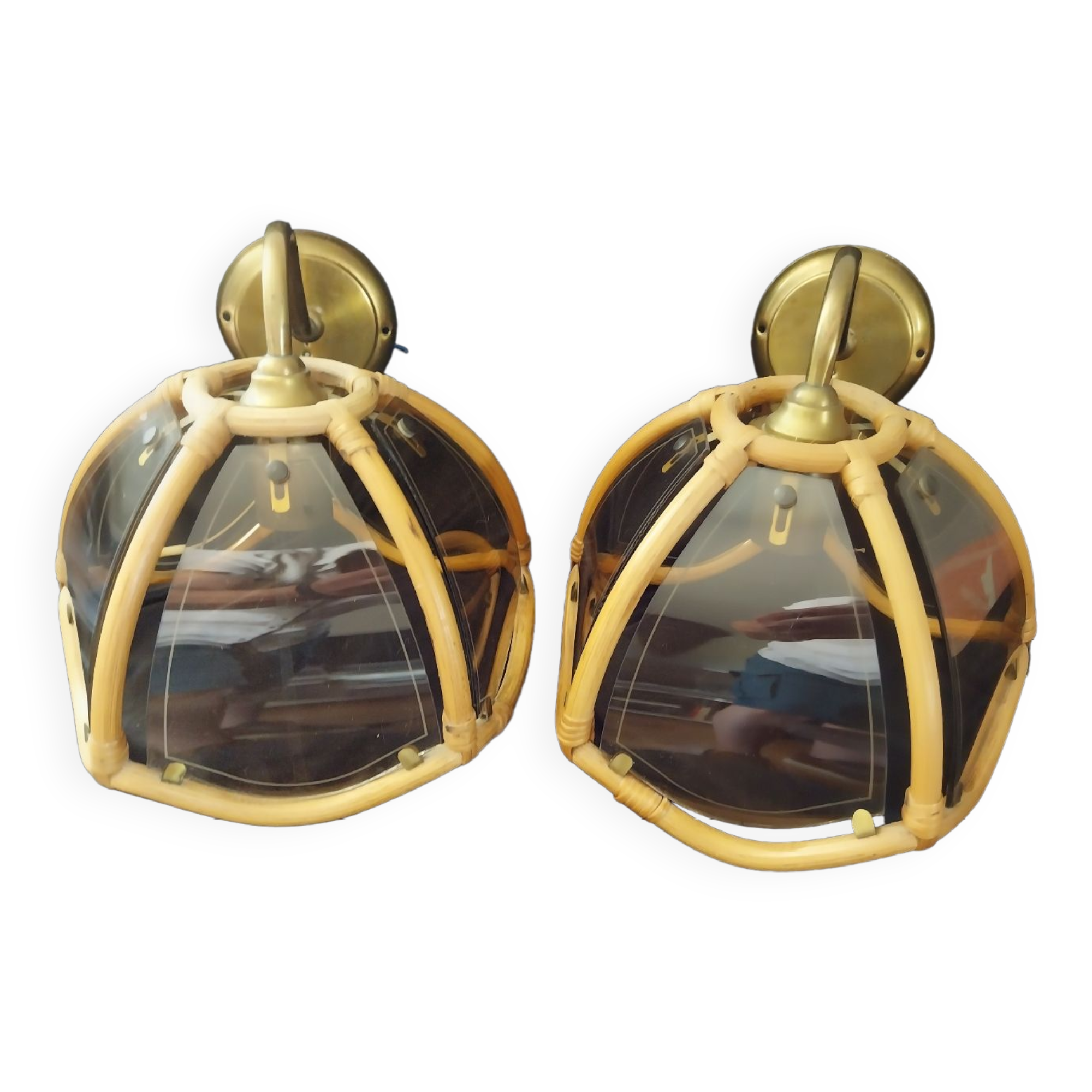 Wall sconces in rattan and smoked glass
