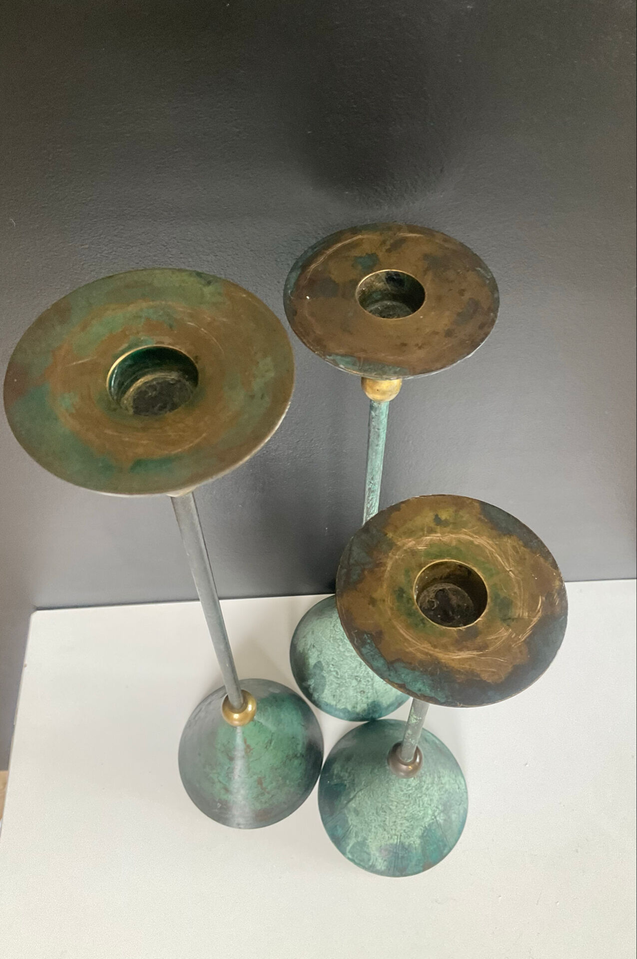 Postmodern metal candlestick trio