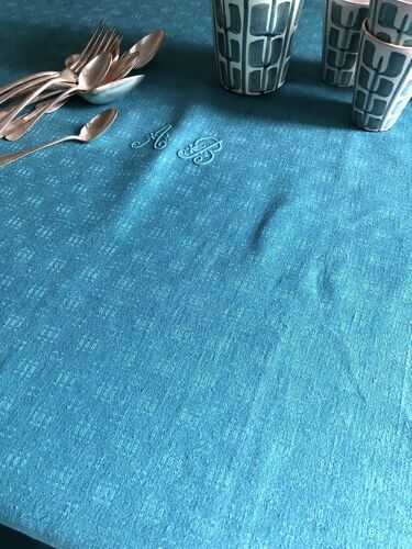 Old damask tablecloth tinted in lagoon blue