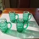 Suite of 4 vintage mugs in green glass