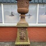 Large old cast iron planter on pedestal