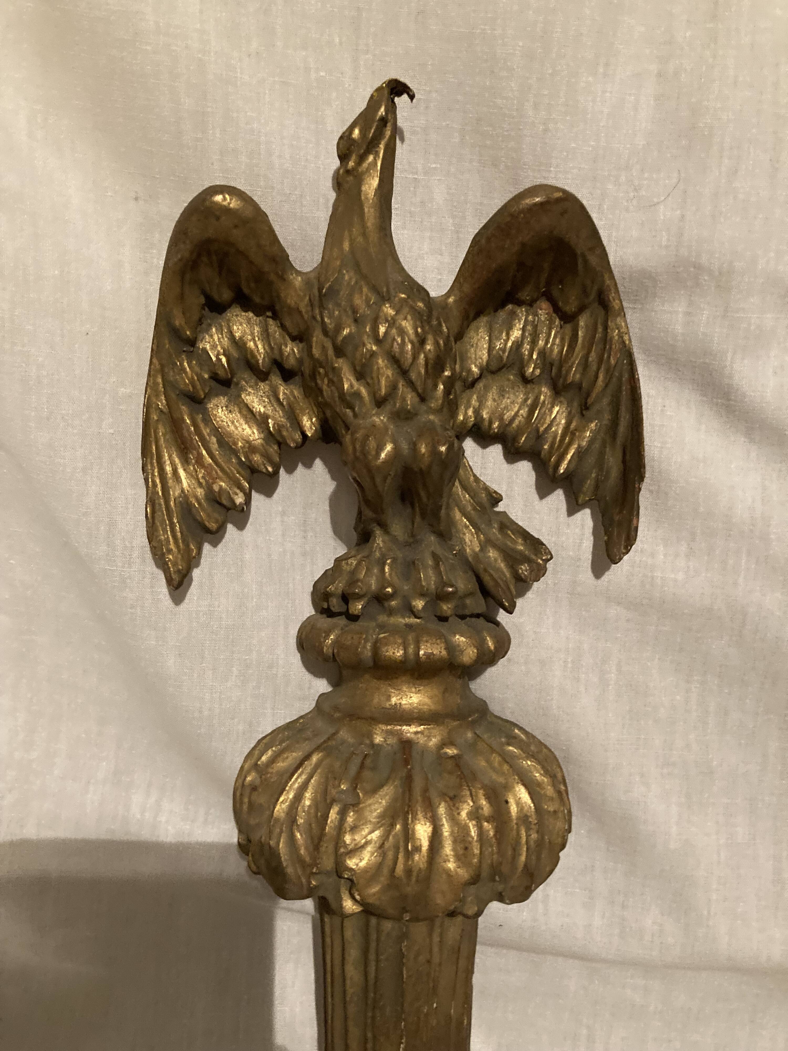 Pair of candle holders in wall, eagle pattern in gilded wood and brass