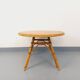 Round coffee table in vintage rattan and wood from the 1960s.