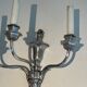 A pair of important Louis XVI style silver-plated wall sconces with three light arms.