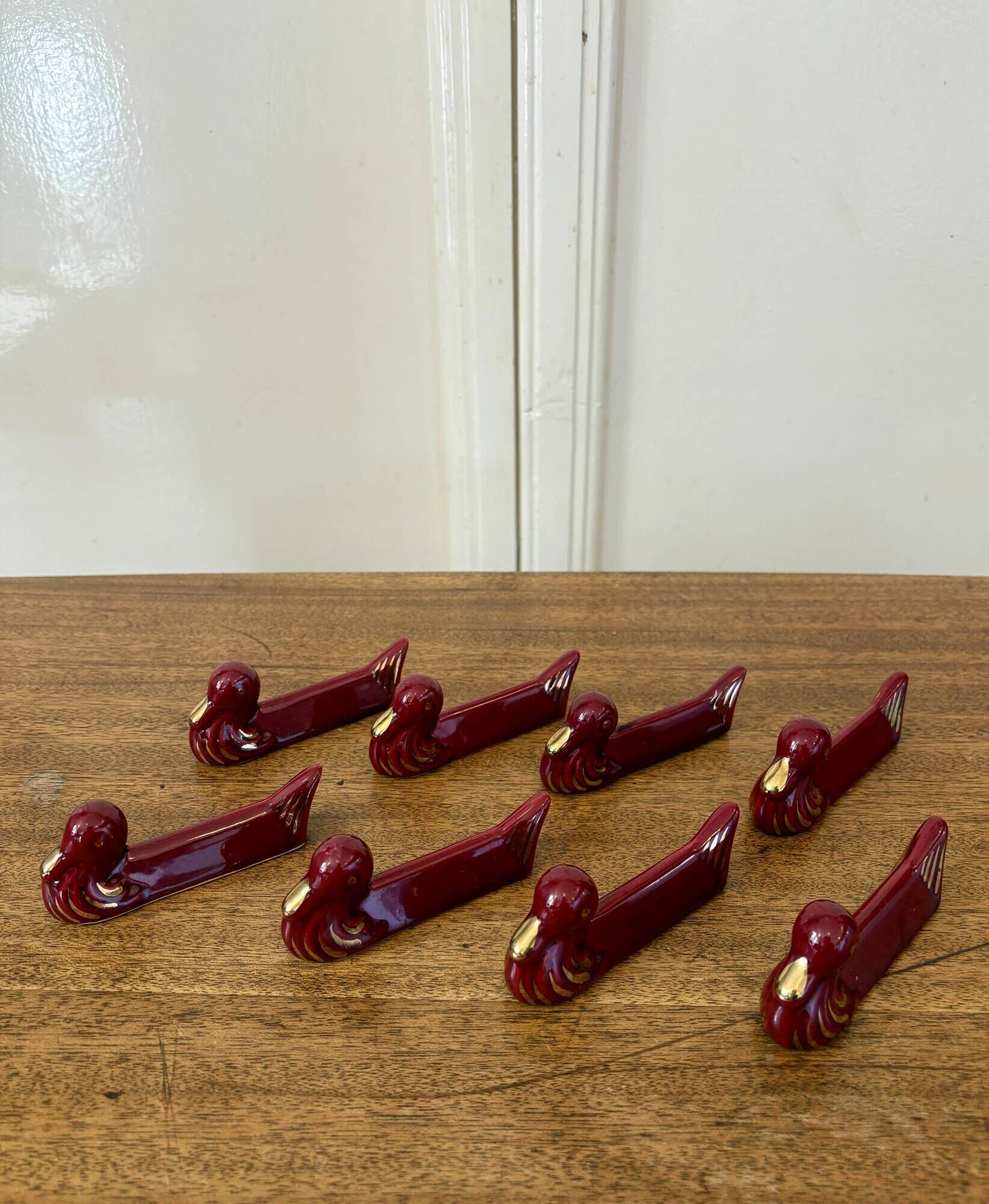 Set of 8 vintage slip knife holders in the shape of red ducks and