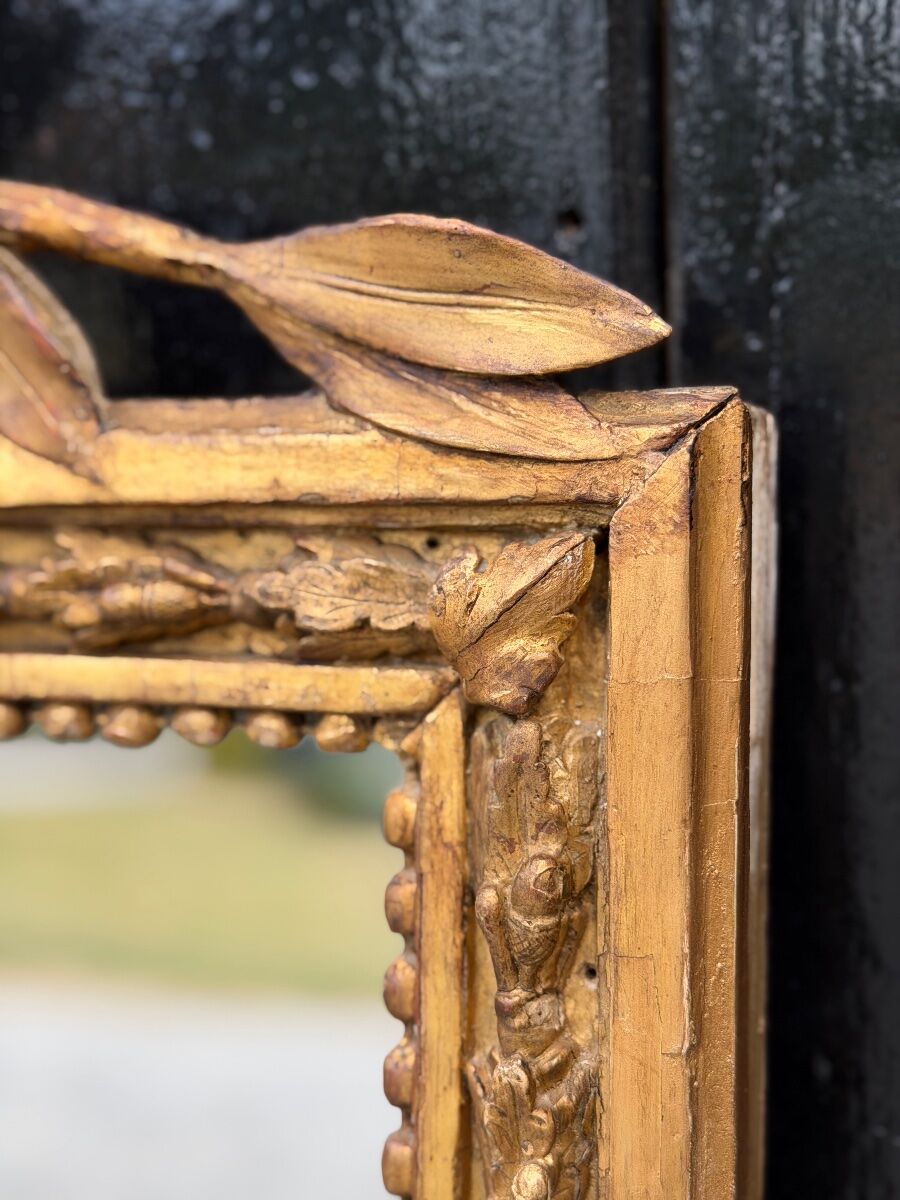 Louis XVI mirror in carved and gilded wood, 18th century