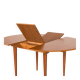 Scandinavian round teak table with hidden extension, 1970s