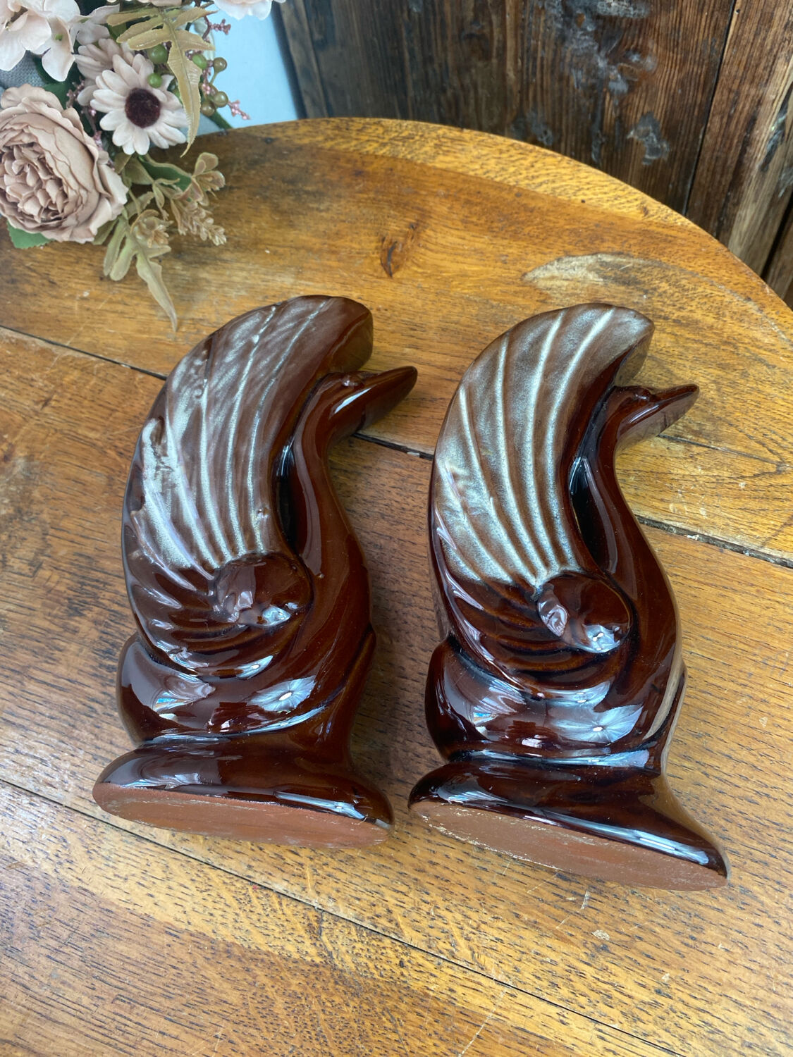 Pair of ceramic vases in the shape of swans.
