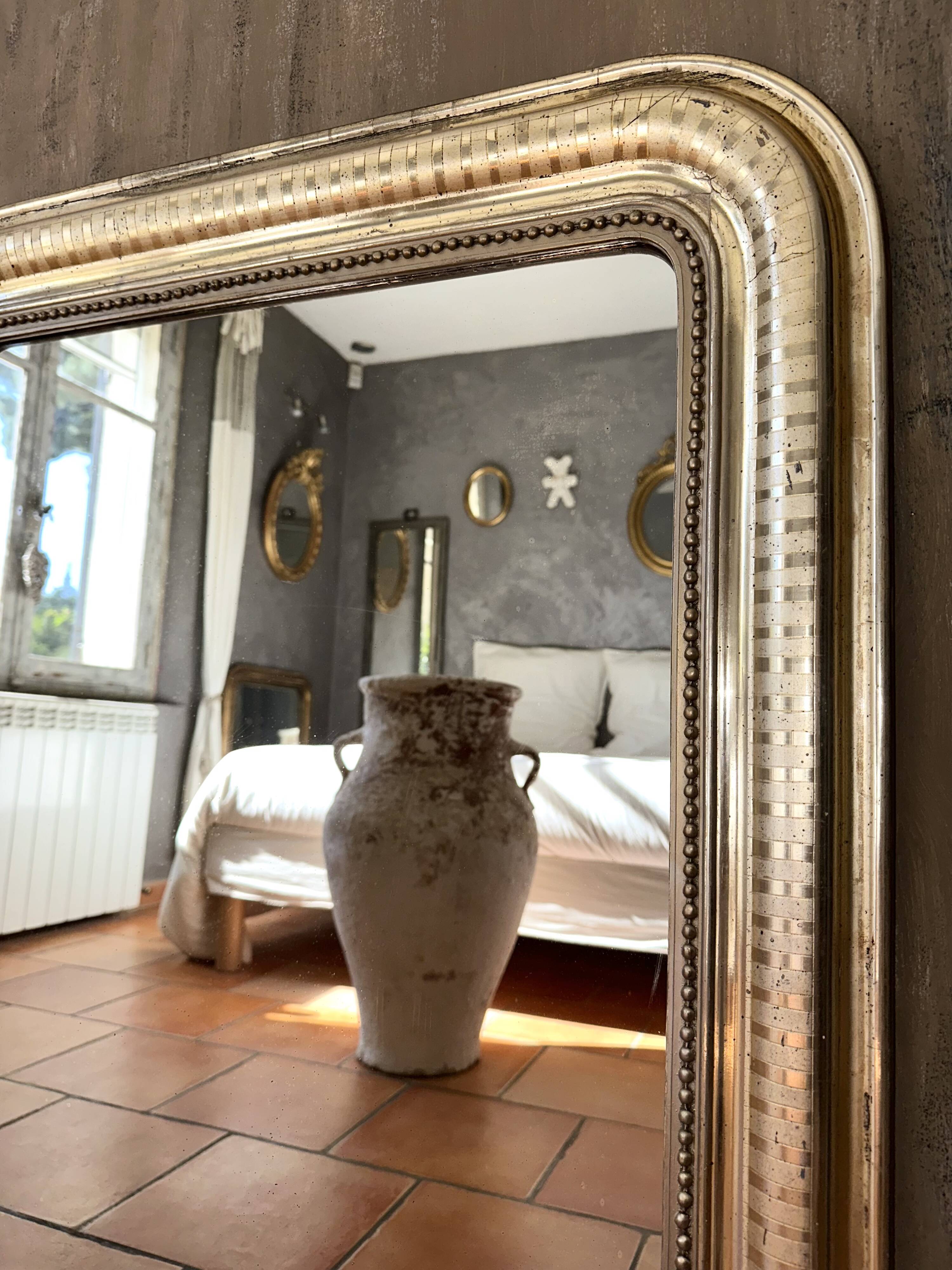 Louis-Philippe antique mirror with silver leaf, 19th century.