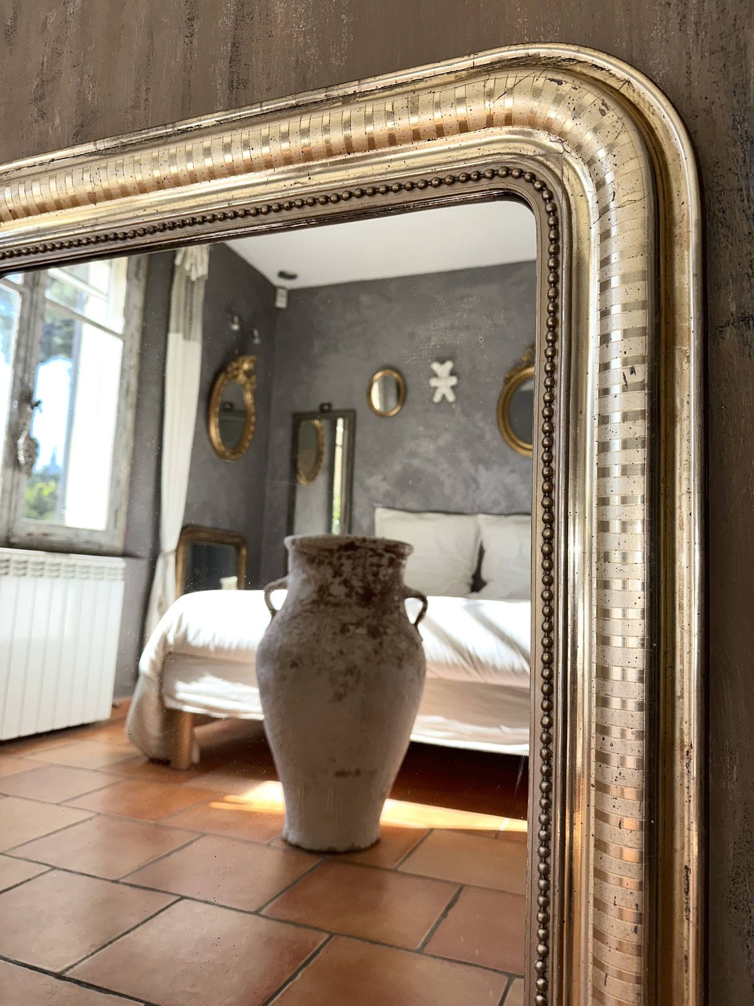 Louis-Philippe antique mirror with silver leaf, 19th century.