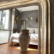 Louis-Philippe antique mirror with silver leaf, 19th century.