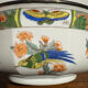 Shallow porcelain dish from Limoges Raynaud, bird decoration.