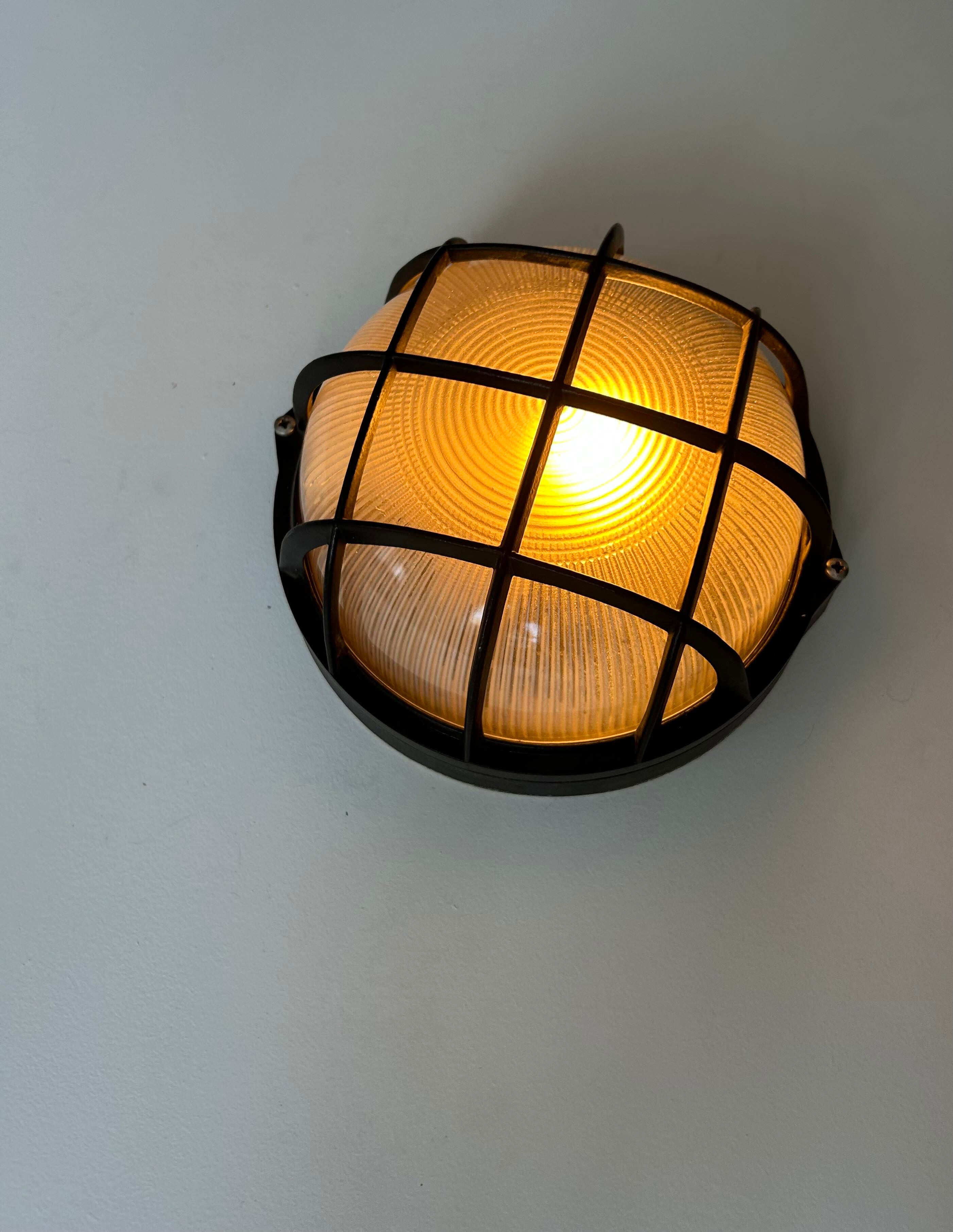 Vintage wall lamp, black metal and ridged glass, France 1980.
