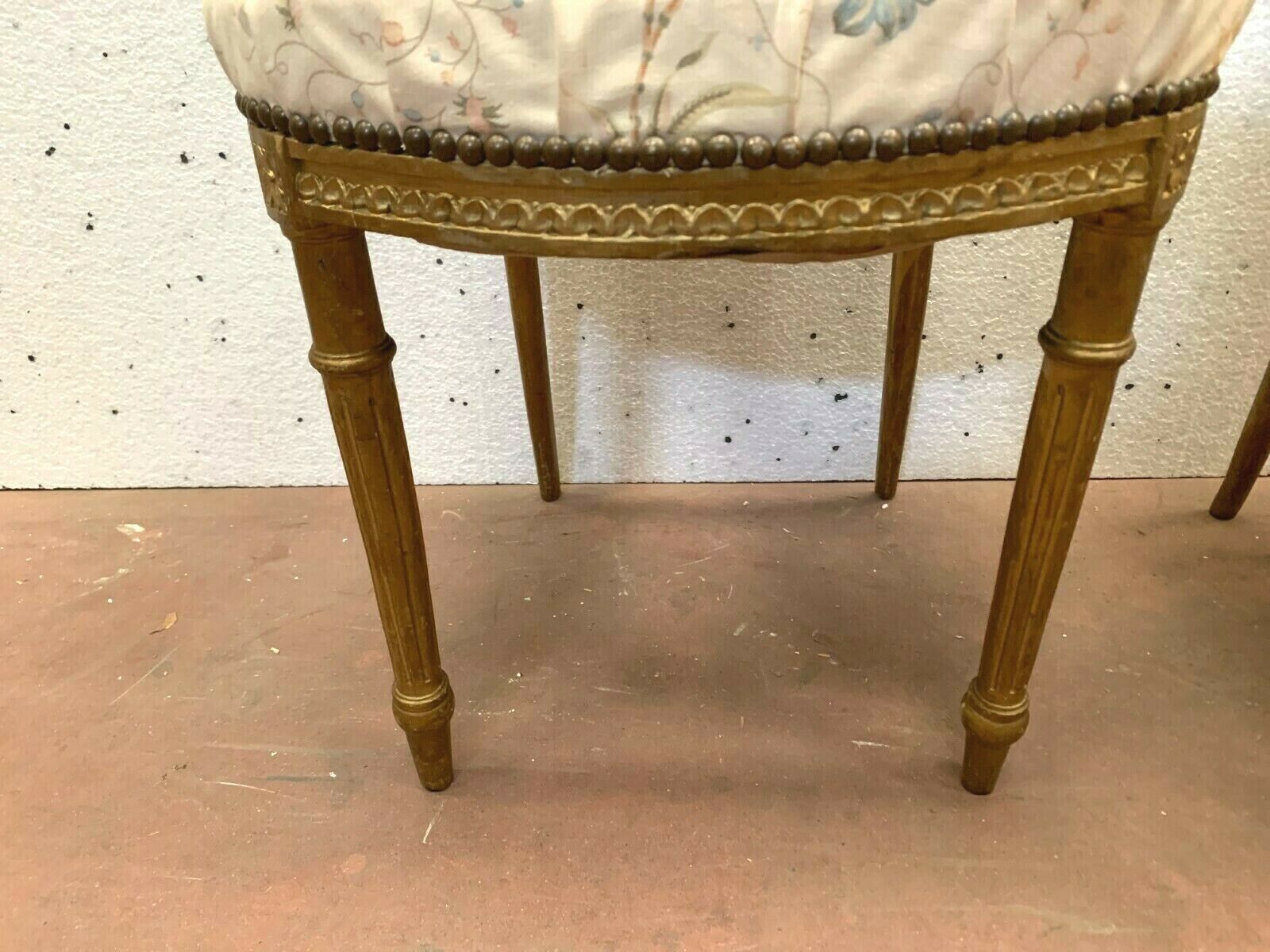 Pair of Louis XVI style chairs in 20th century gilded wood