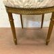 Paire de chaises de style Louis XVI en bois doré XX siècle