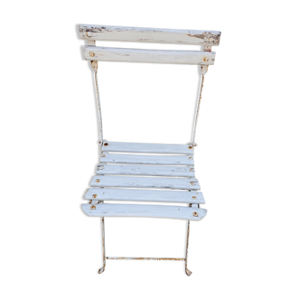 Wooden slatted garden chair with wooden slats and iron feet