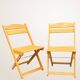 Paire de chaises pliantes en bois blond
