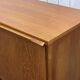 1970s English enfilade in teak with splayed legs.