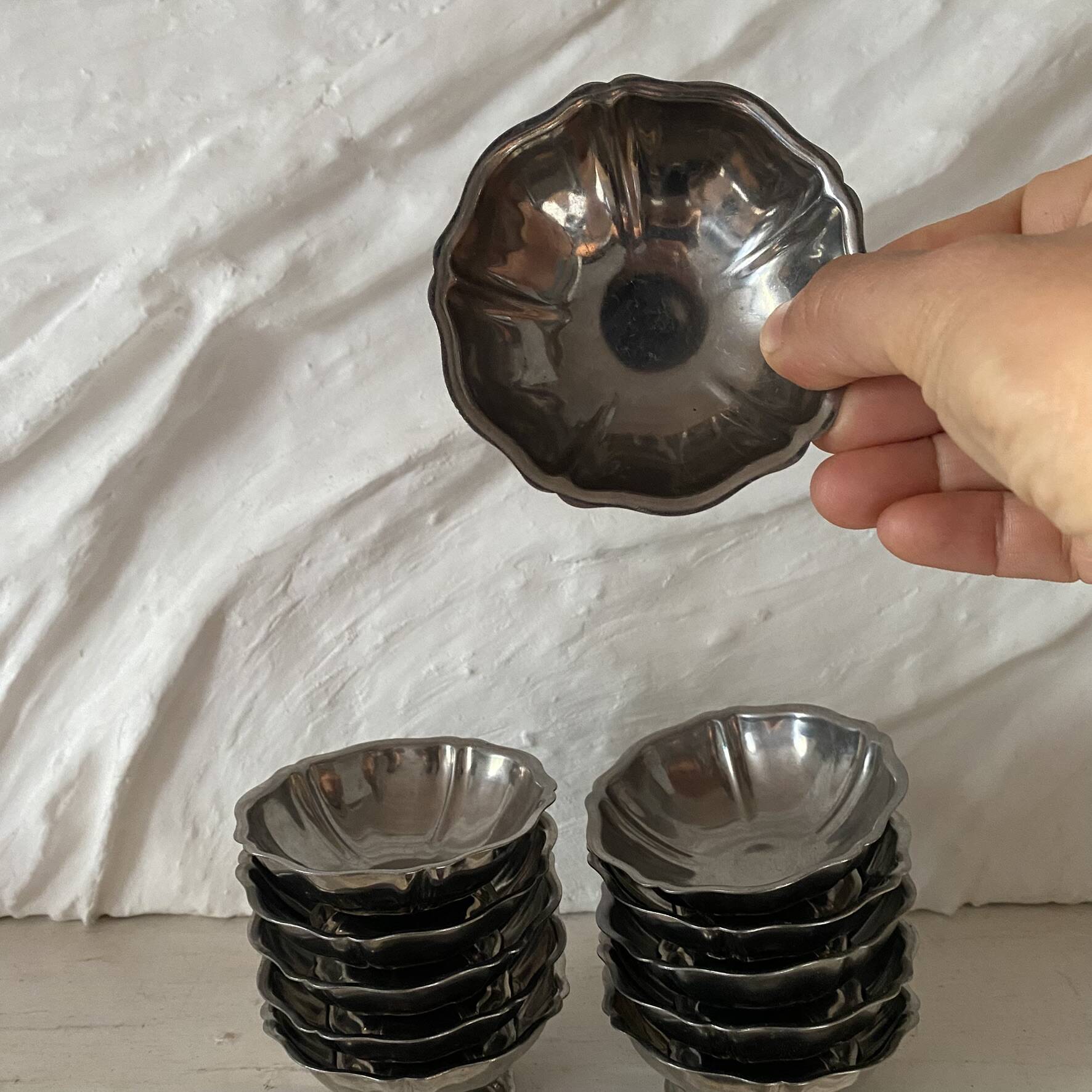 Stainless steel ice cream bowls for one scoop.
