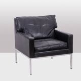 Pair of armchairs in black leather and chrome metal. 1970s.