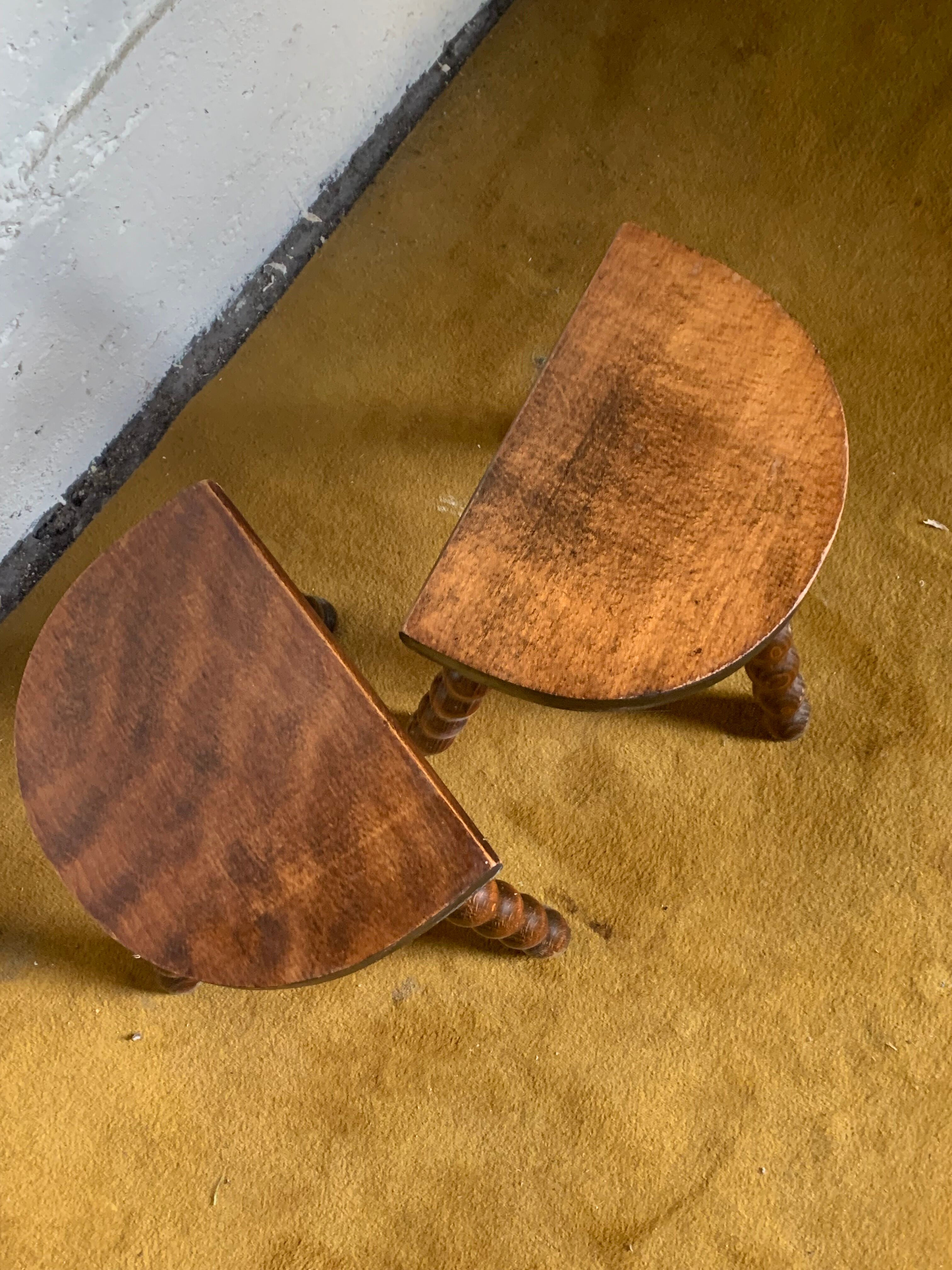 Duo of tripod half-moon stools