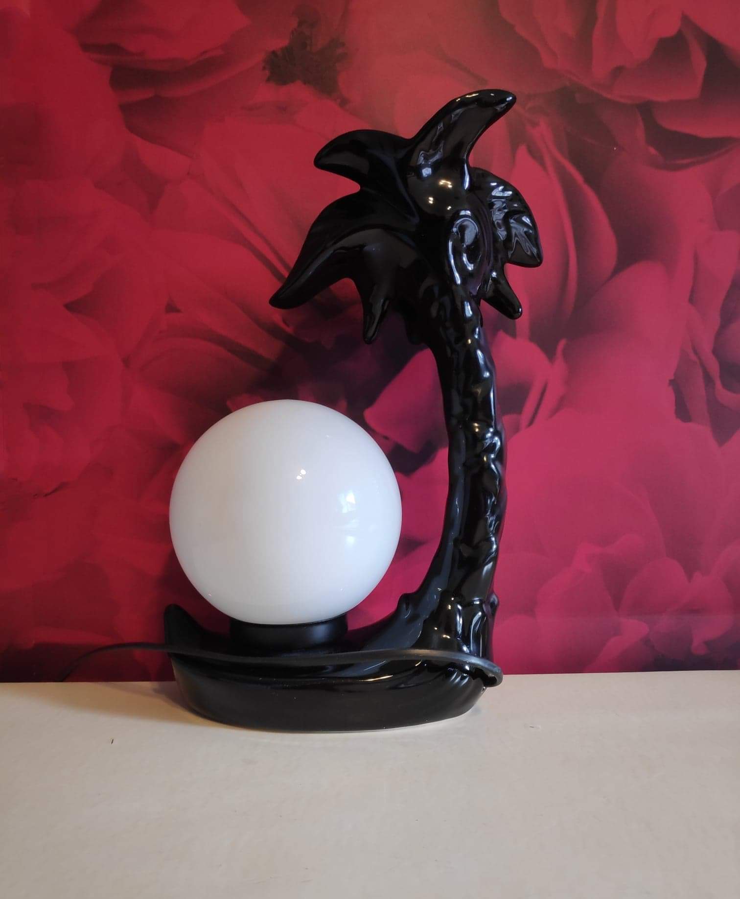 Black ceramic palm lamp and white opaline globe
