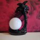 Black ceramic palm lamp and white opaline globe