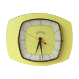 Pendule, Bayard wall clock in yellow formica from the 60s