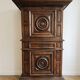 Antique Louis XIII bonnetière in carved solid wood.