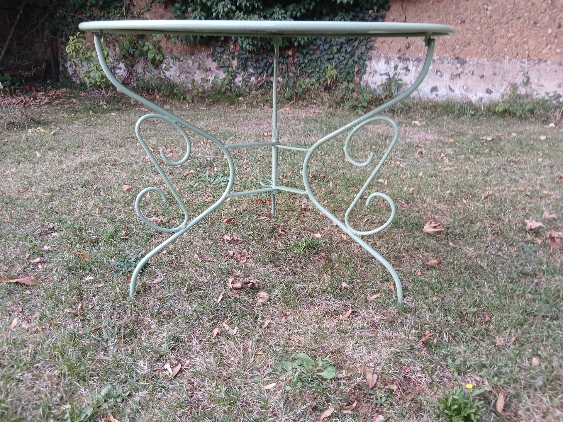Garden furniture set with 1 table, 2 armchairs, and 2 chairs in antique green wrought iron.