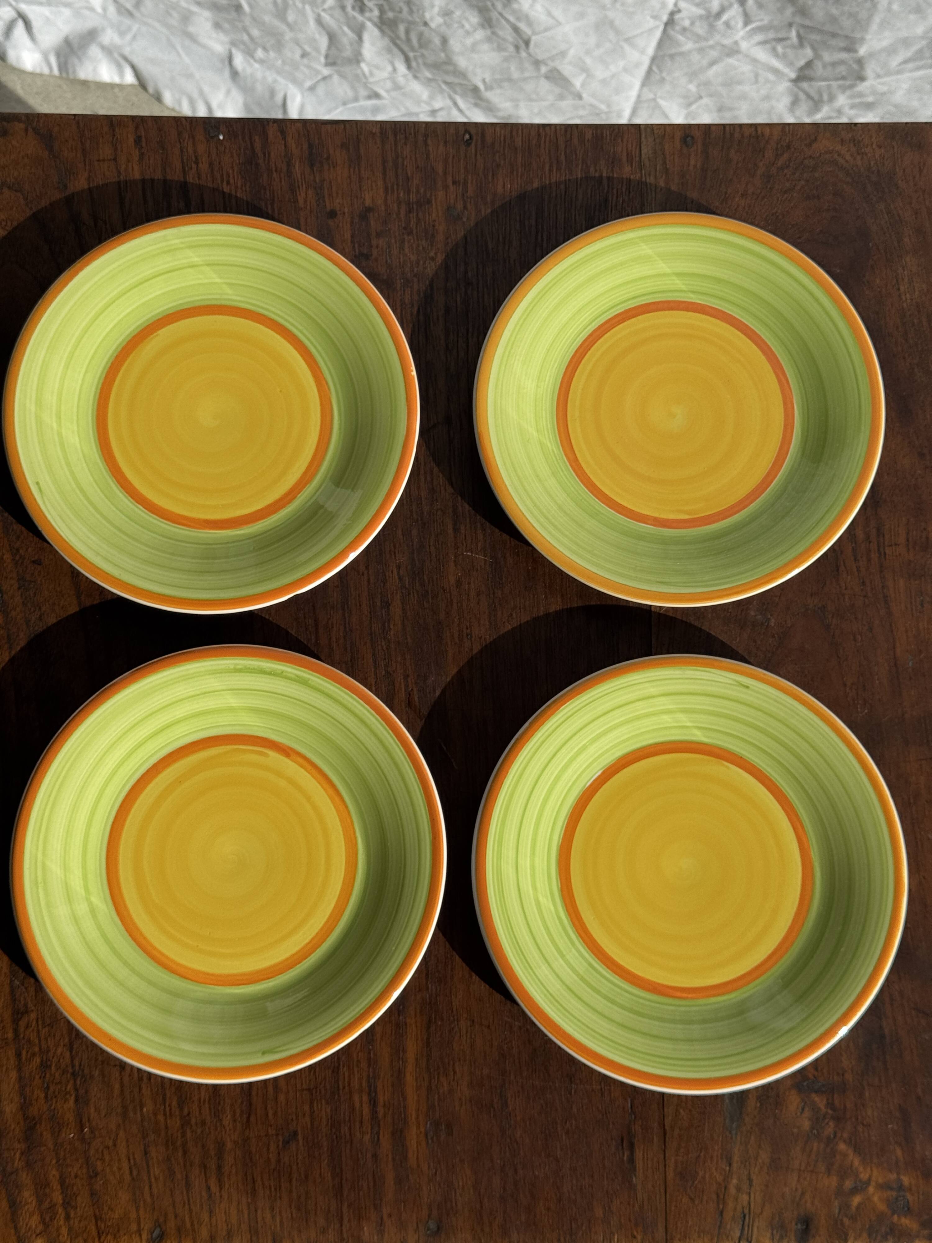 Set of 4 Italian ceramic plates in green, orange, and yellow splashes D20.