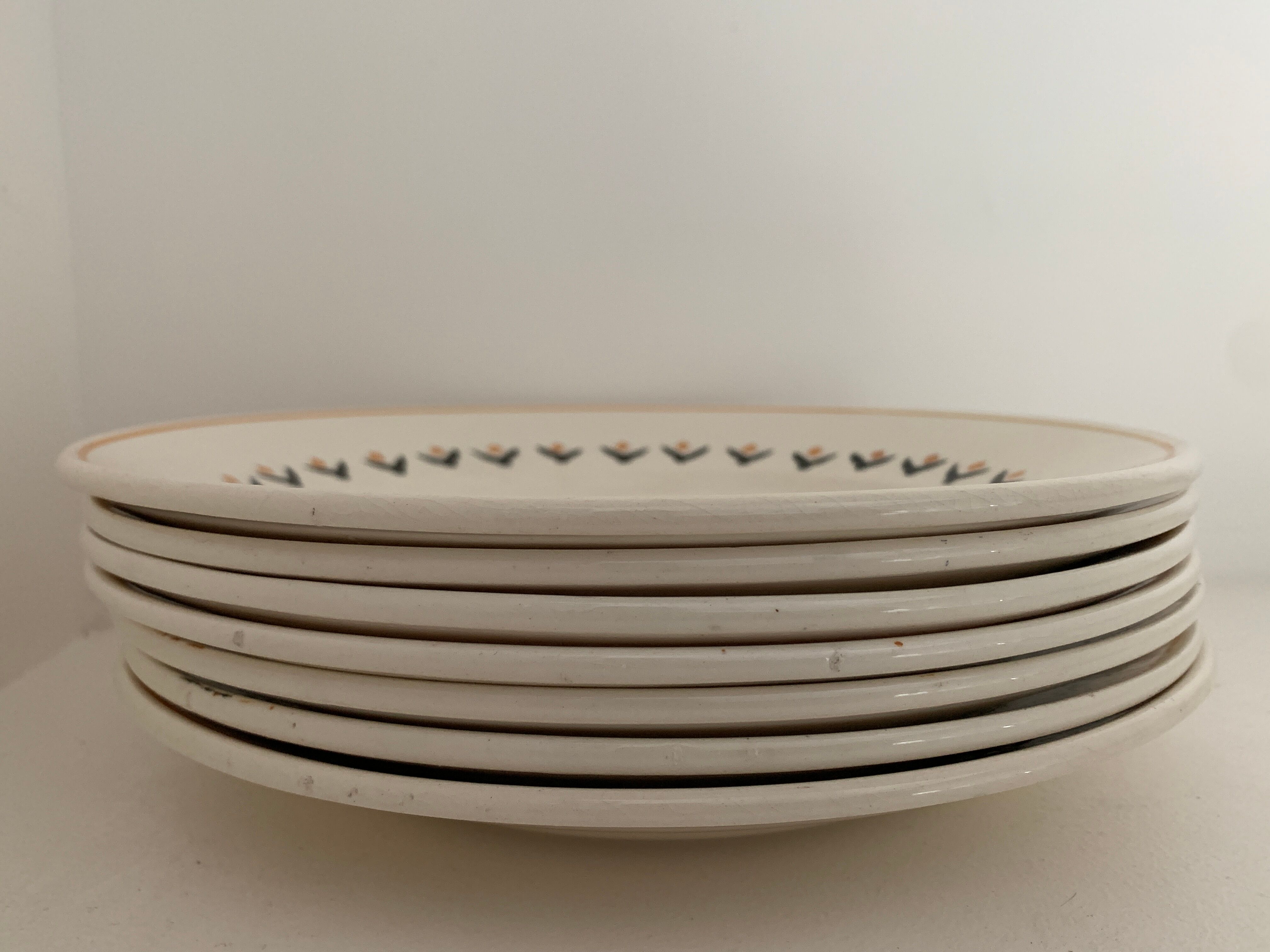 7 dessert plates and one Longwy dish
