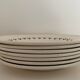 7 dessert plates and one Longwy dish