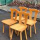 4 rounded Scandinavian dining chairs in solid pine from the 1980s.