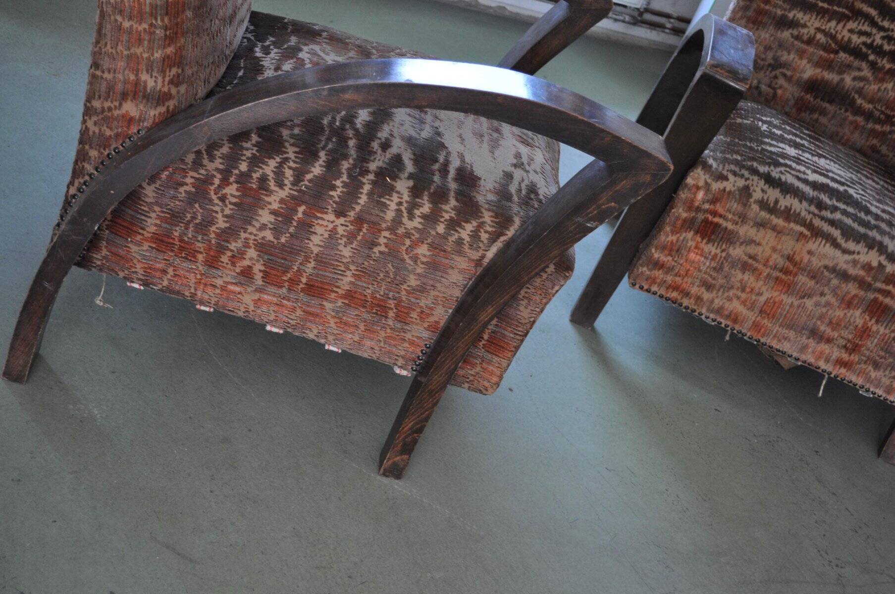 Pair of Art Deco armchairs in curved wood and multicoloured fabric from the 1920s.
