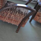 Pair of Art Deco armchairs in curved wood and multicoloured fabric from the 1920s.