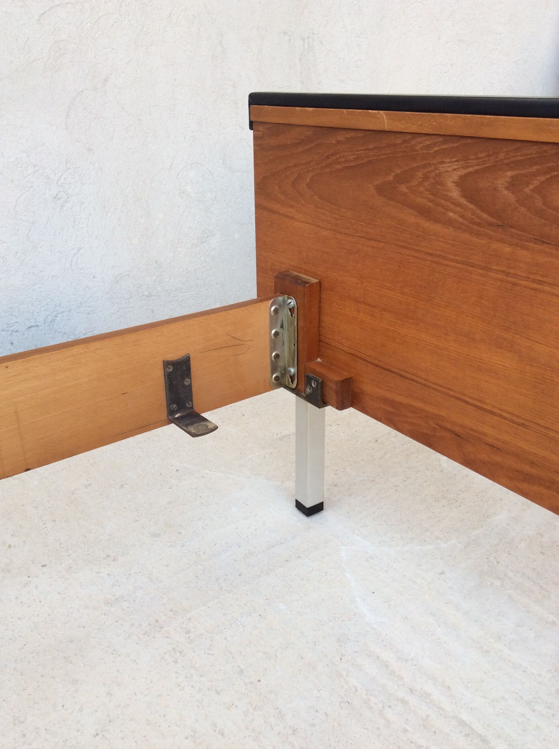 Scandinavian-style teak bed with integrated nightstands