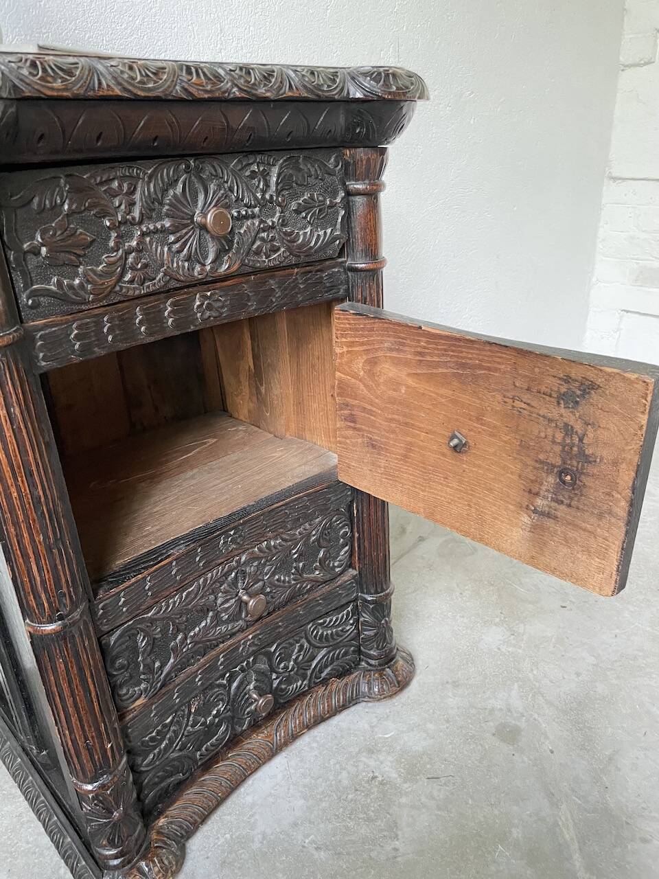 19th century chest of drawers in carved blackened pine